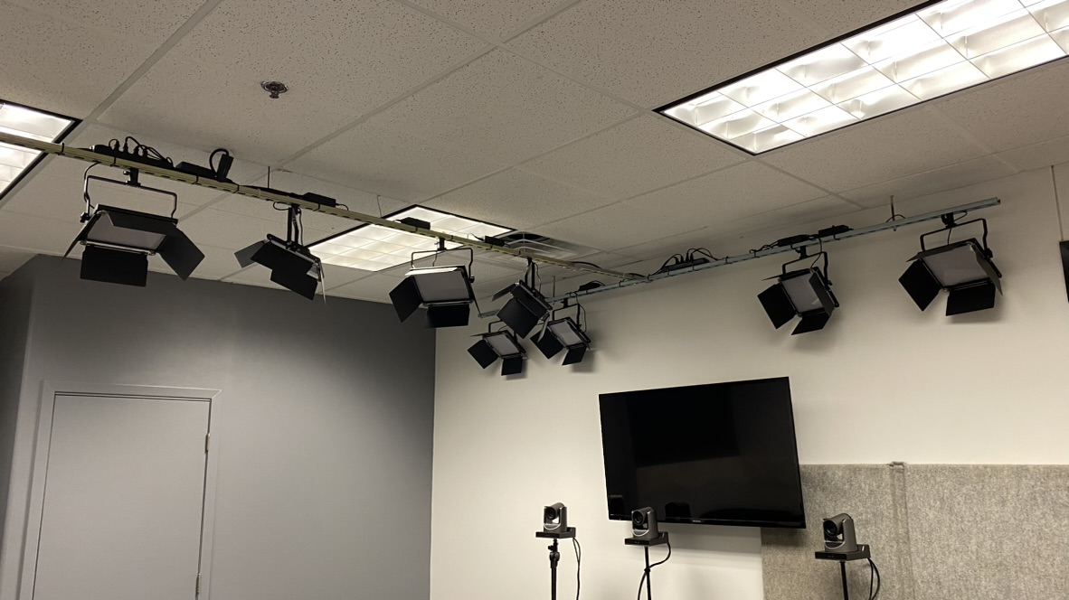Camera and lighting equipment in a studio space