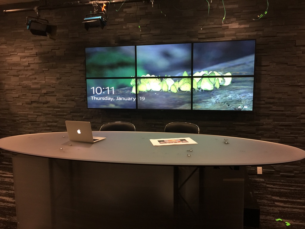 A multi-screen conference room display installation