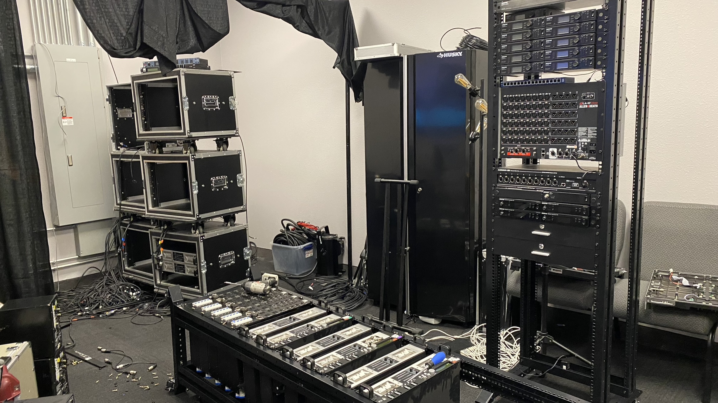 Installed audio and wireless equipment racks in a technical room